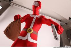 JOEL_ADAMSON CHRISTMAS VALLAIN WITH GUN AND BAG